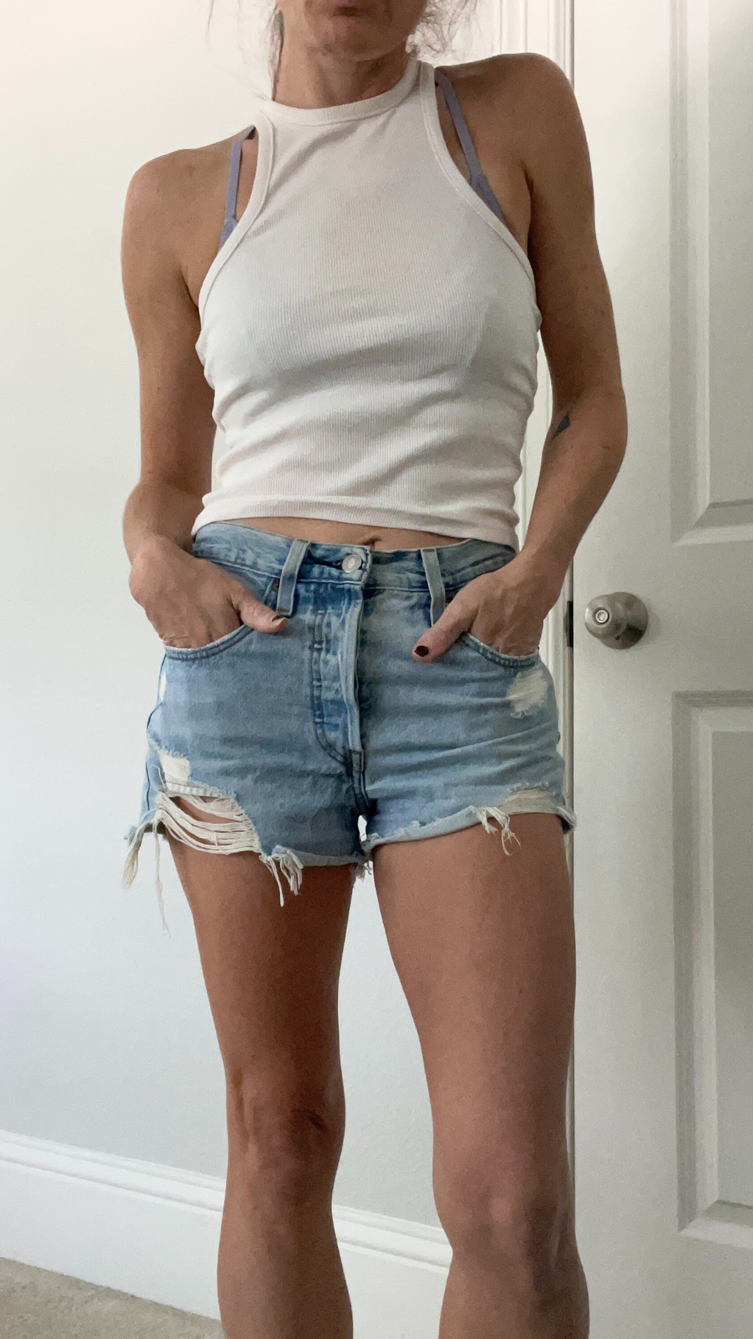 Featuring Levi's 501 Original denim shorts paired with a white tank top