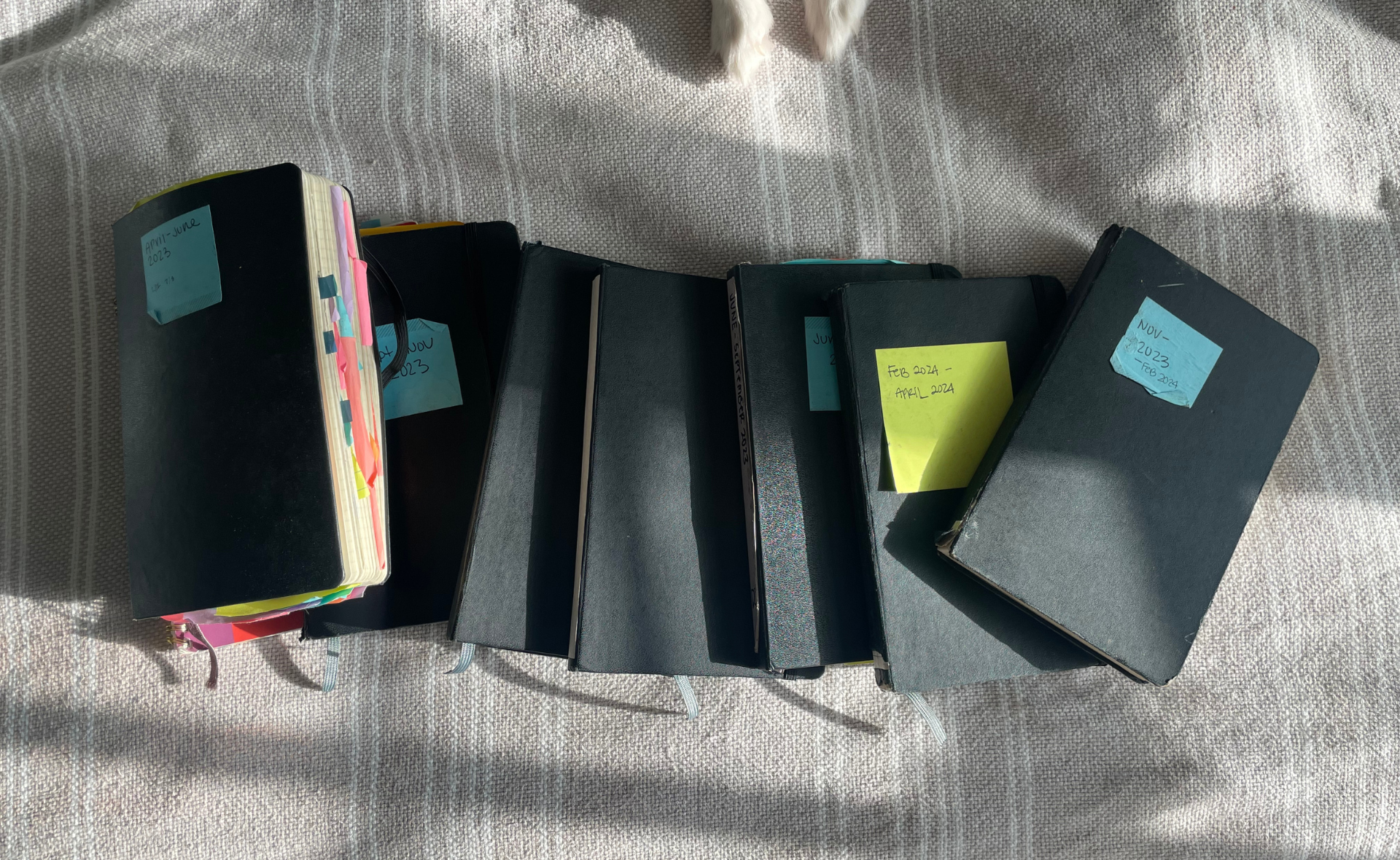 My journals from a year of writing, check out my three tips to become consistent at journaling.